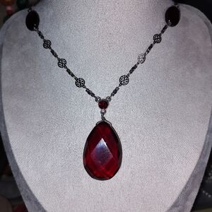Ruby red glass pendent on beautiful silver tone chain
